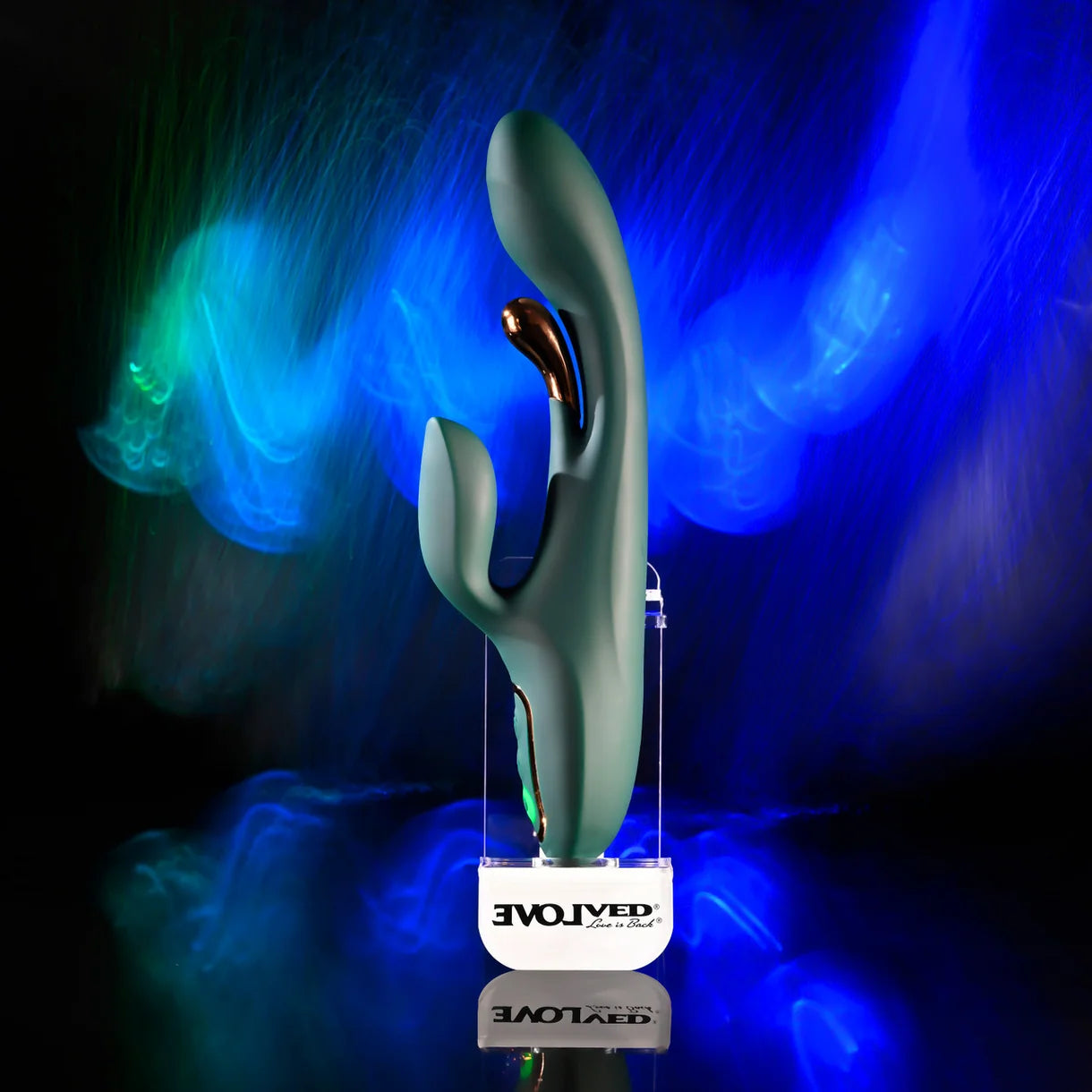 green curved vibrator with metal flicker with clitoral stimulation on colored background