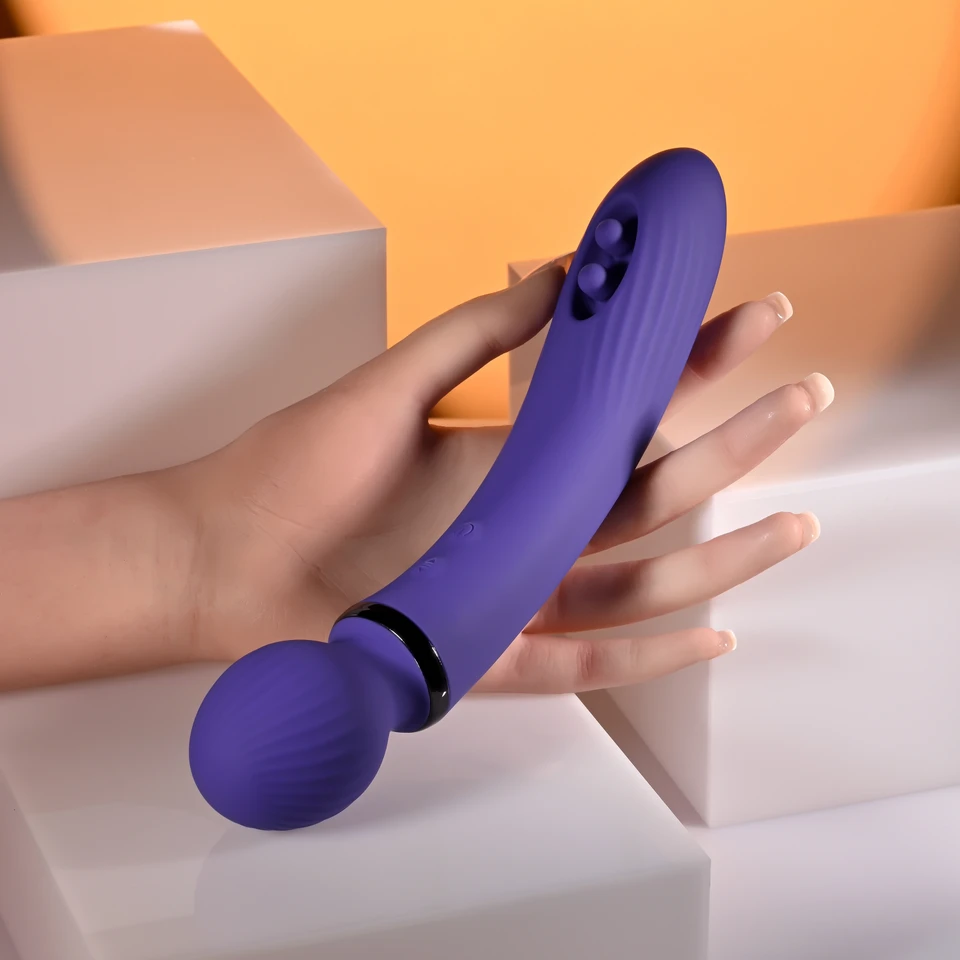 purple wand held in hand