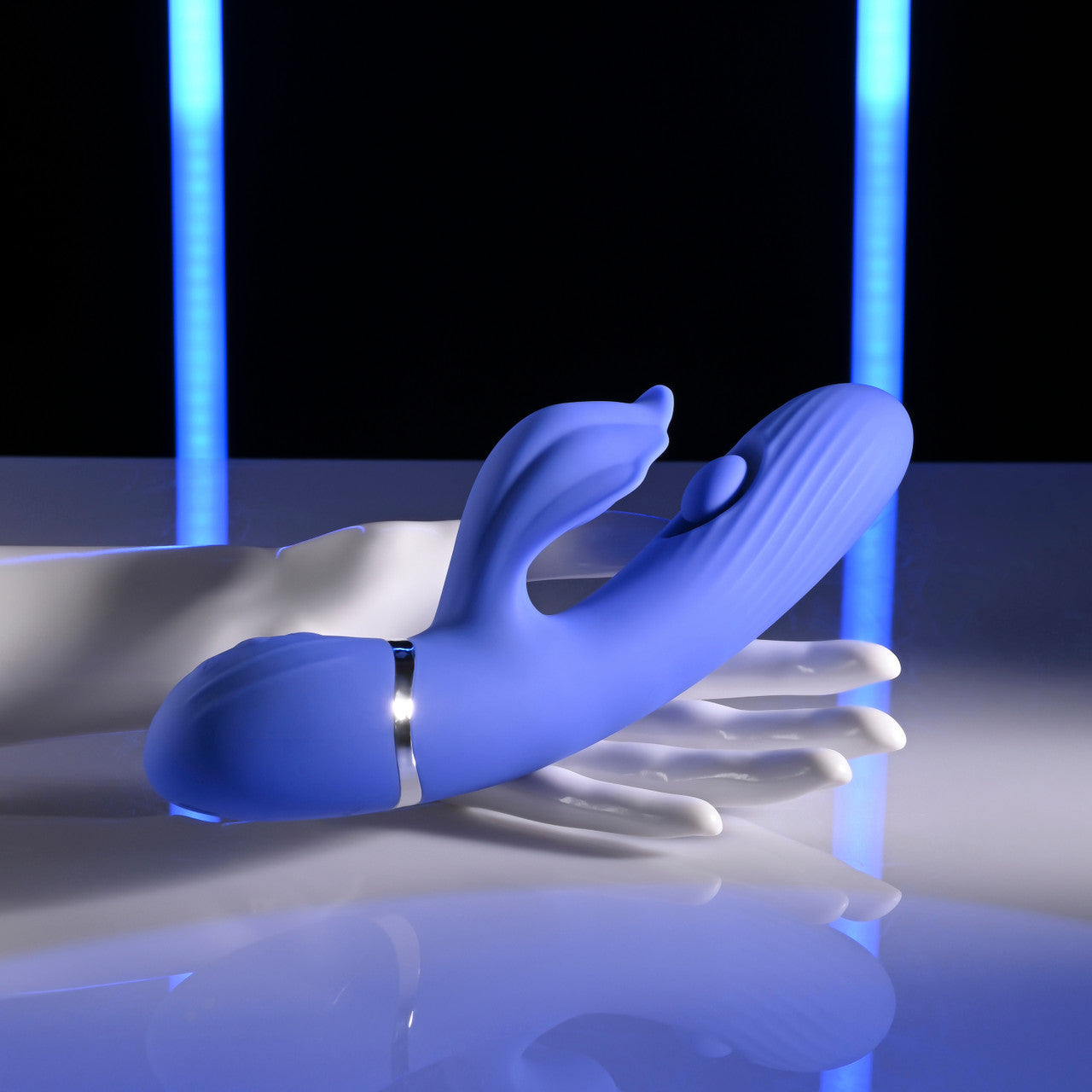 blue vibrator, with clit stimulation and flicker held in hand