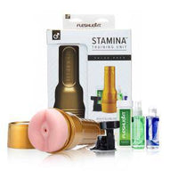 Fleshlight Stamina training unit with packaging and accessories on a white background