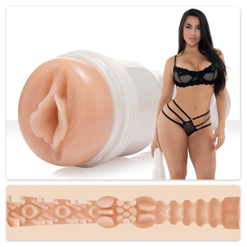 adult star lena the plug honey wearing black lingerie, standing beside molded fleshlight vagina masturbator with texture