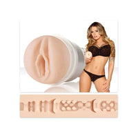 adult star teagan presey wearing brown lingerie, standing beside molded vagina fleshlight masturbator with texture