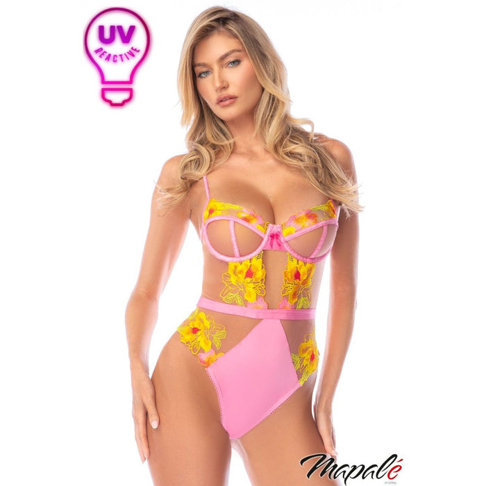 Woman wearing a colorful bikini with floral design, branded 'Mapale'.