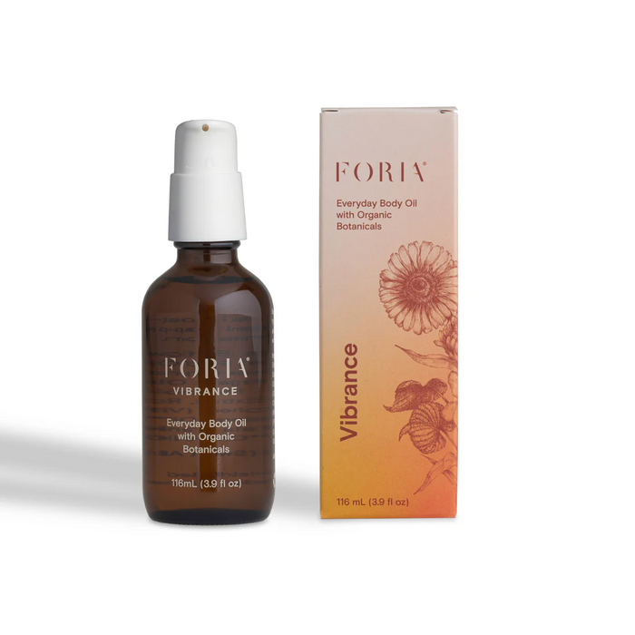 Foria vibrance everyday body oil 116ml bottle beside packaging.