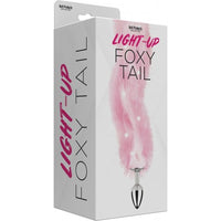 pink fox tail on silver anal plug on box cover