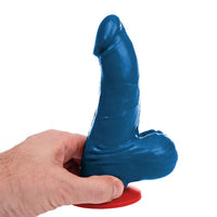 Blue silicone dildo held by a hand on a white background