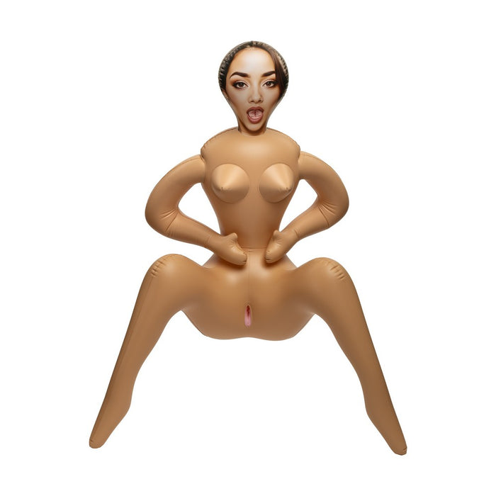 An inflatable adult novelty toy shaped like a seated nude female figure with a printed face, isolated on a white background.