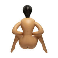 An inflatable adult novelty toy mannequin with a realistic tan skin tone and a glossy black head, shown from the back against a solid white background.