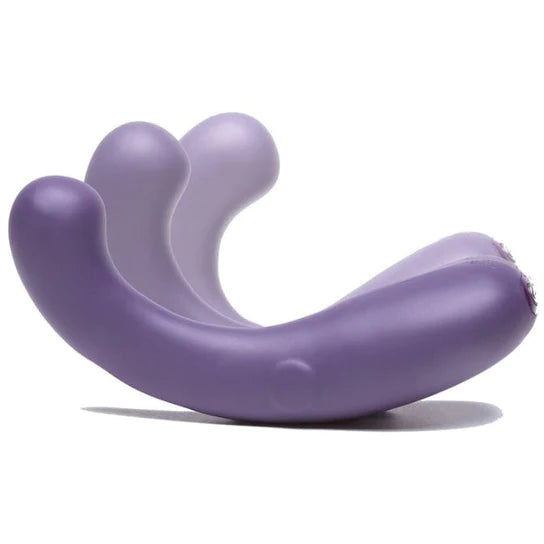 curved purple vibrator on white back ground