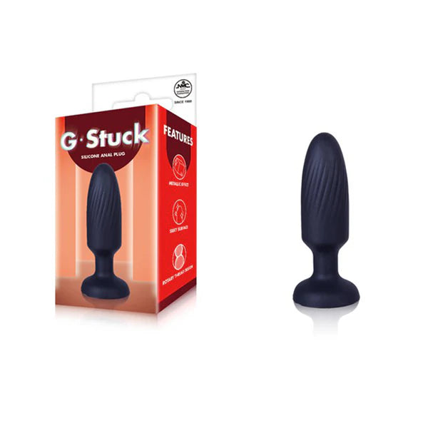 g stuck black metallic anal plug beside packaging