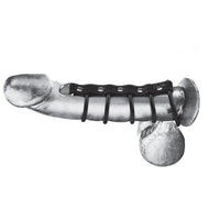 Erect penis with the 5 black silicone type rings around it. One ring around the penis and the balls and the remaining 4 around the shaft of the penis. The 5 rings are attached by a black leather like type of material. There is a 6th silver ring at the end of the material 