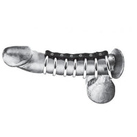 Erect penis with one silver ring around the base of the penis and the balls with the 6 remaining silver rings around the shaft of the penis. All silver rings are attached by a black leather like material 