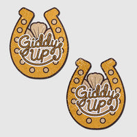 Two gold horseshoe-shaped patches with 'Giddy Up' text on a light gray background