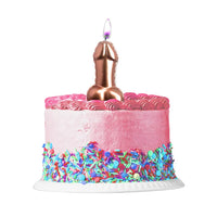 Pink penis balloon birthday candle with cake with colorful sprinkles.