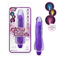 A purple glitter-filled dildo shown next to its retail blister packaging. The package features the brand name 'blush' and product name 'Molly', with circular inset images on the right demonstrating the color-shifting LED light effect.