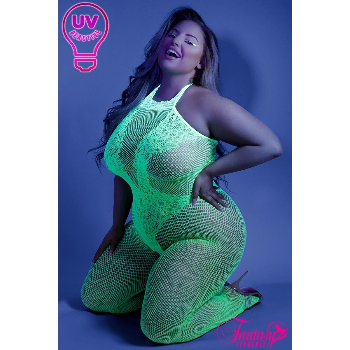 blond female on knees with green fishnet bodystocking front view