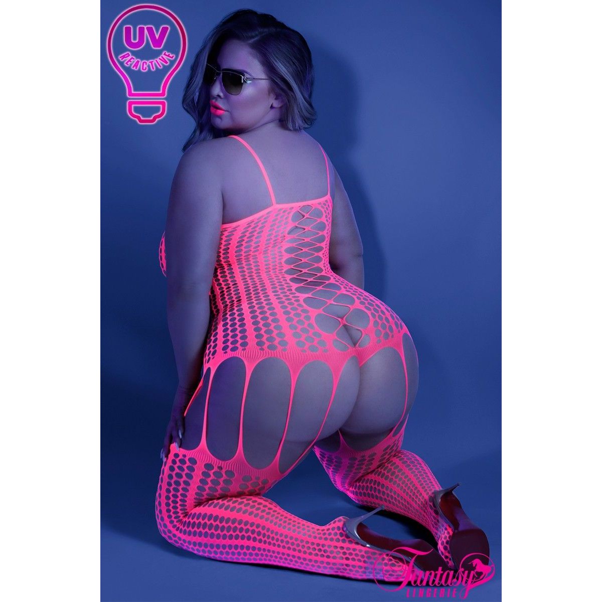 blonde female on knees in pink honeycomb bodystocking back view