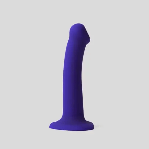 Purple led light up dildo on a white background