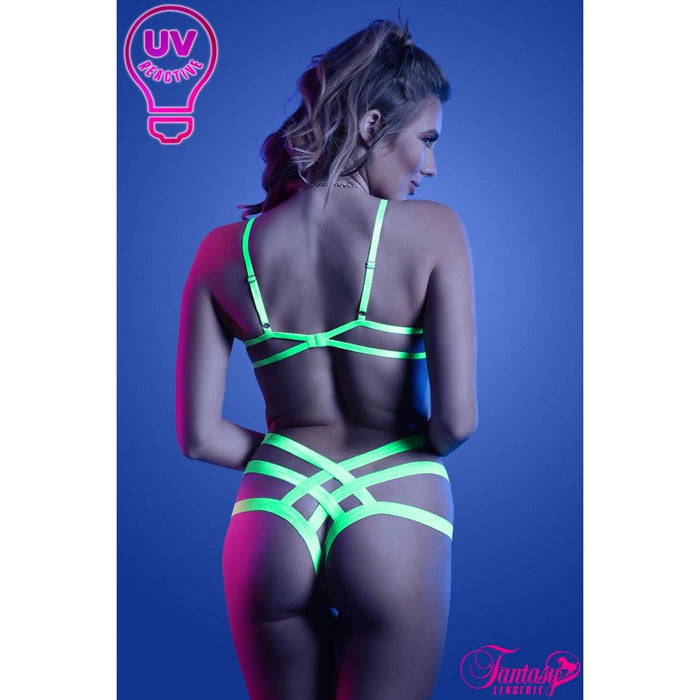 female standing with strappy uv bra & panty set back view