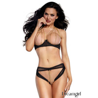 woman wearing a bikini with openings with gold chains