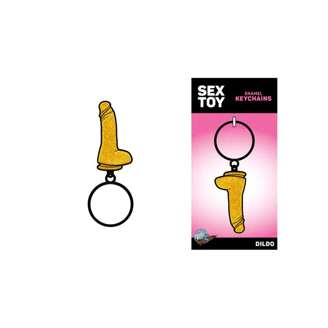 The image features the "Glitter Dildo" Metal Keychain by Wood Rocket, which is pink and has a sparkling, playful design. It is displayed both on its own and in packaging that includes a stylish 5" x 2.