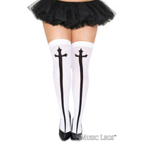 White thigh-high stockings with black cross designs on the front, worn by a model with a black tutu skirt and black heels, shown against a white background.