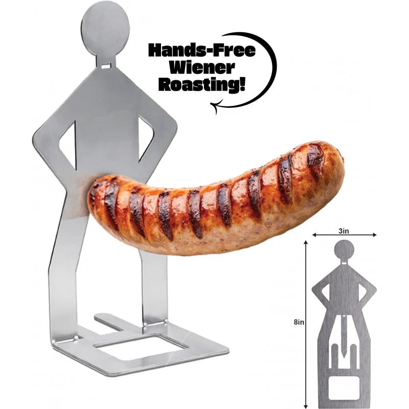 A stainless steel hands-free sausage roaster stand shaped like a person, shown holding a grilled sausage. The image includes text reading 'Hands-Free Wiener Roasting!' and a small side view of the stand with dimensions marked as 3in wide and 8in tall.
