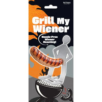 Grill My Wiener novelty handless grilling tool on its retail packaging card, featuring a cartoon silhouette of a person and a cooked sausage on a grill.