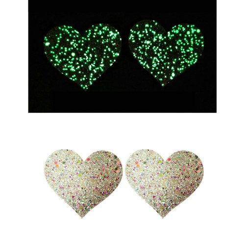 Heart-shaped glittery pasties with a black background