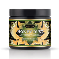 Jar of 'Honey Dust' kissable body powder with decorative label on a white background. honeysuckle