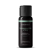 Serum bottle labeled 'wicked sensual massage oil honeysuckle & ivy' on a white background