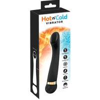 a black and white product box depicting a black vibrator with a slanted head, a gold band at the base of the shaft and a round base with function buttons