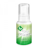 Bottle of toy cleaner with a green label on a white background