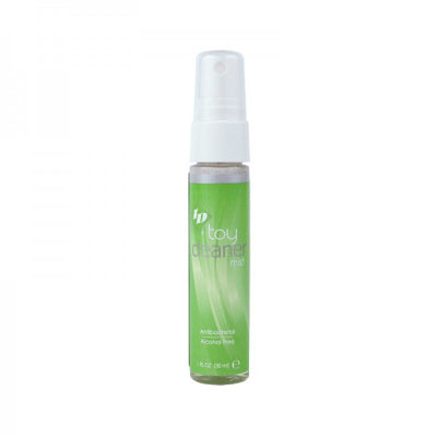 Green spray bottle with white cap on a white background