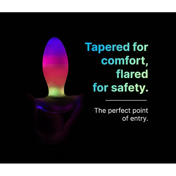 Colorful anal plug with text on a black background