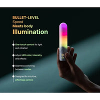 Hand holding a glowing illumination the bullet vibrator  with text about its features on a dark background