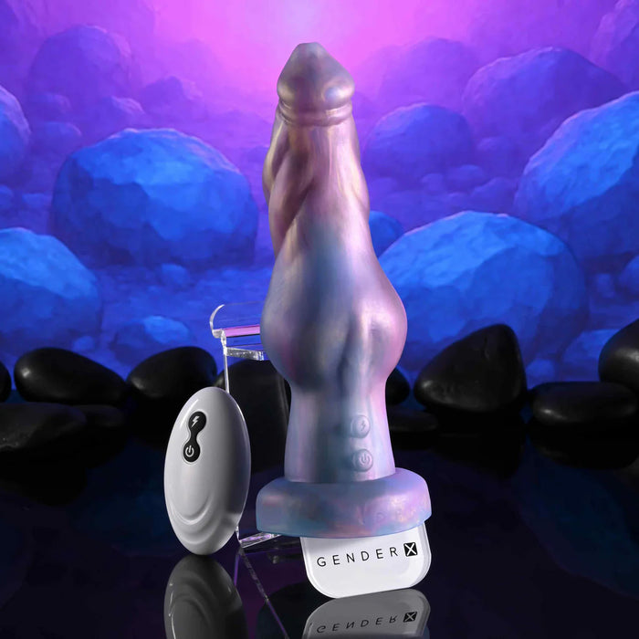 imaginary friend vibrating dildo with 'GENDERX' branding against a rocky underwater background