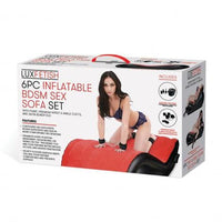 white box with woman in cuffs on red and black sex sofa