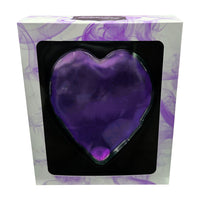 Purple heart-shaped object in a box with a purple and white patterned background