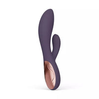 Purple silicone vibrator on a white background