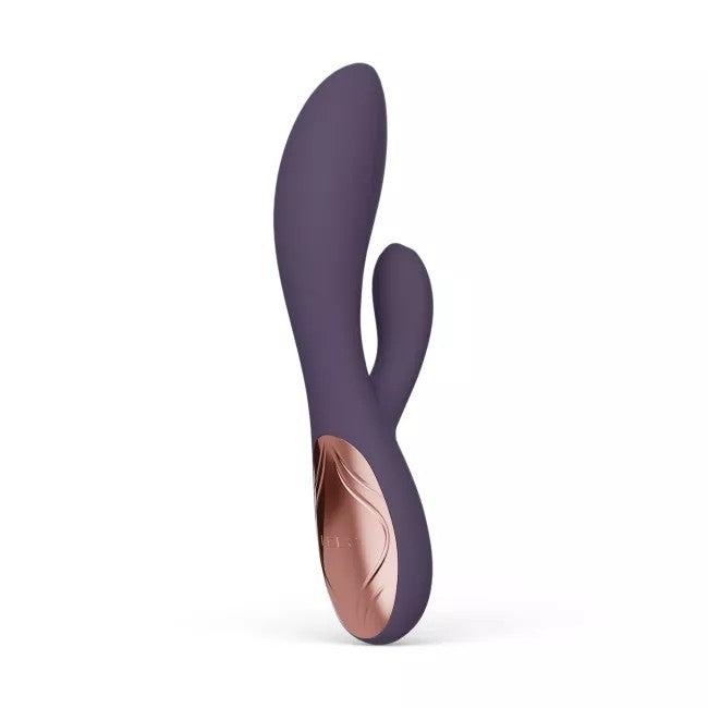 Purple silicone vibrator on a white background