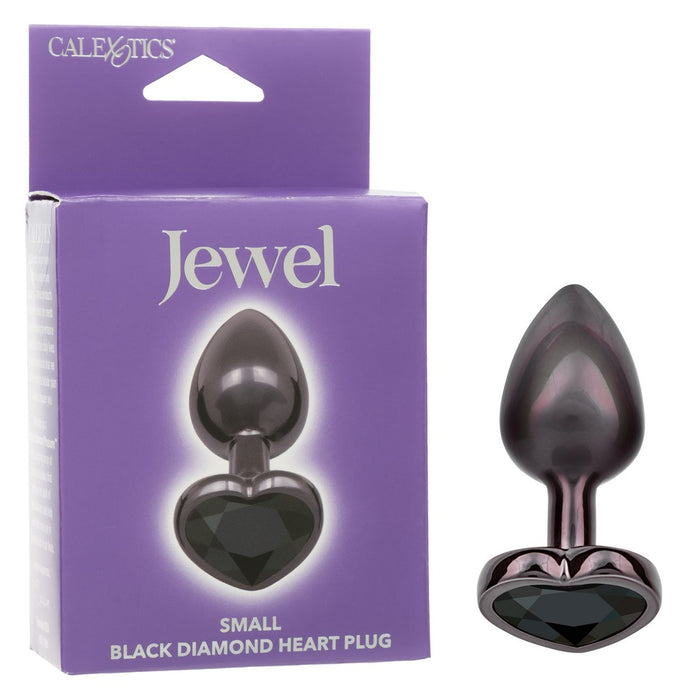 black small anal plug with heart bottom and black gem beside box packaging