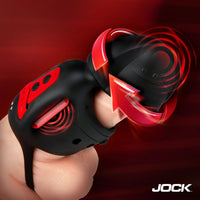 Black and red masturbator with a visible brand logo on a dark background