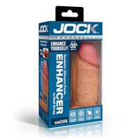 realistic silicone penis enhancer with ball strap in tan in blue packaging