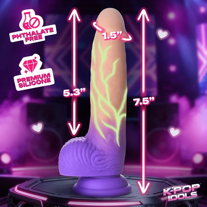 An adult novelty product shown on a stylized purple stage-like background with measurement arrows and text indicating 5.3 inches, 7.