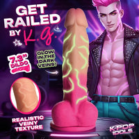 Promotional graphic for a novelty product featuring a realistic dildo with glowing green vein details, alongside a stylized male model and text reading 'GET RAILED BY K.G.