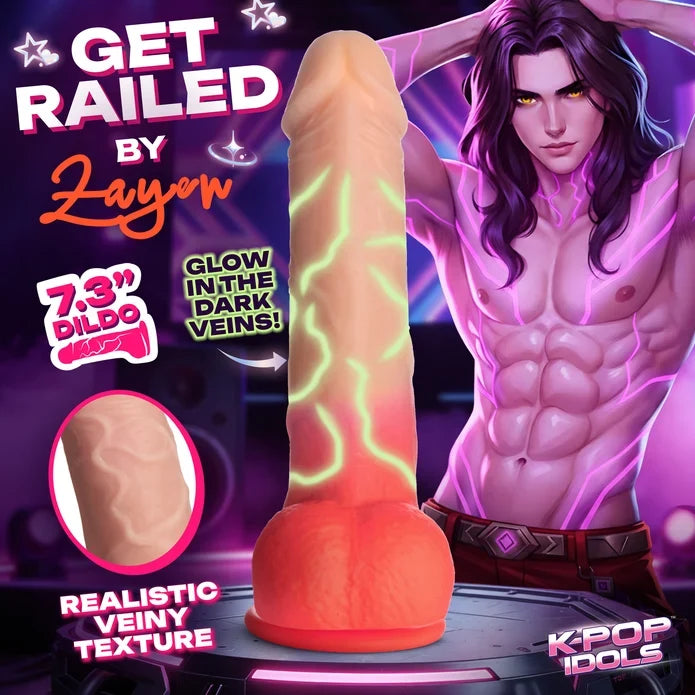 Promotional graphic for a novelty dildo with a realistic flesh-toned shaft and glowing green vein-like lines, plus an orange bulb base. Large text reads 'GET RAILED BY Zayon,' '7.
