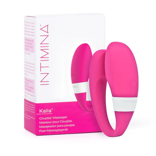 a pink and white c-shaped vibrator shown next to its pink and white display box