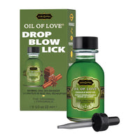 Green bottle of 'Oil of Love' with packaging on a white background