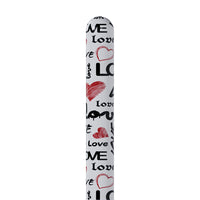 White cylindrical vibrator with 'Love' and heart designs on a white background